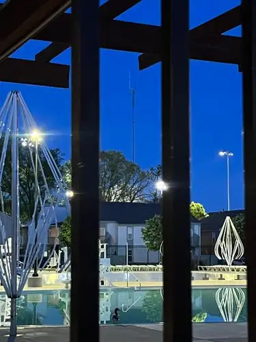 Twilight frames a calm scene through architectural lines.